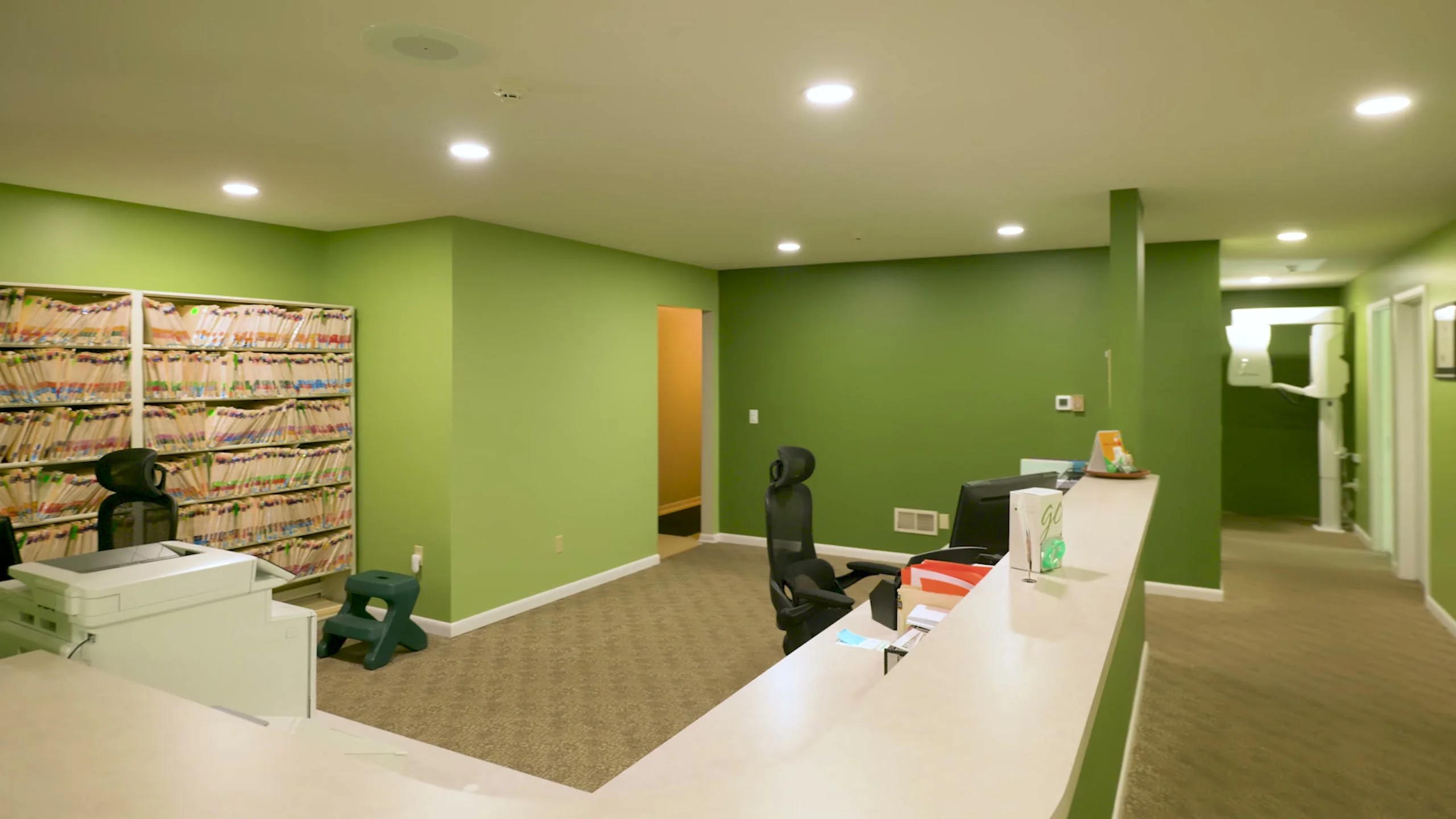 The front desk and hallway inside the Broadway Dentistry general dentistry office in Fort Wayne, Indiana