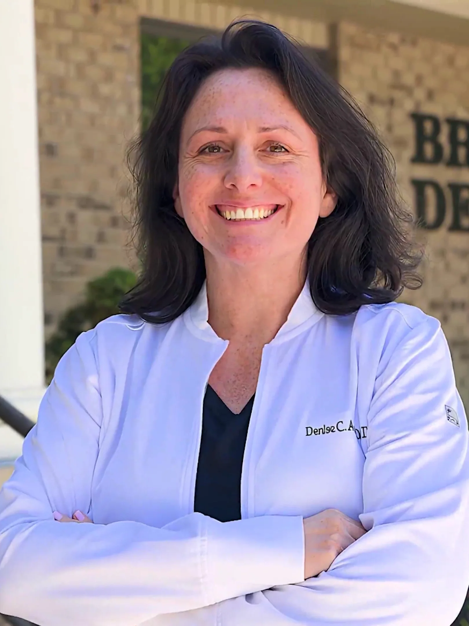 Dr. Denise Acosta, general dentistry, outside the Broadway Dentistry office in Fort Wayne